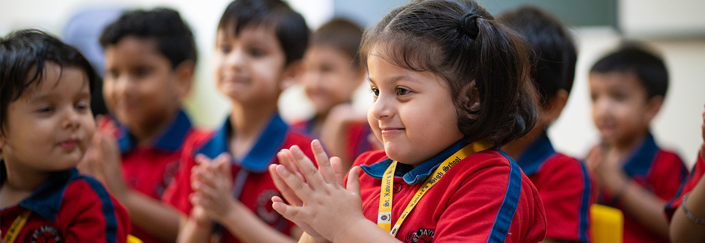 Kids clapping in class at the best CBSE school in Gurgaon. A private school in Gurugram fostering learning.