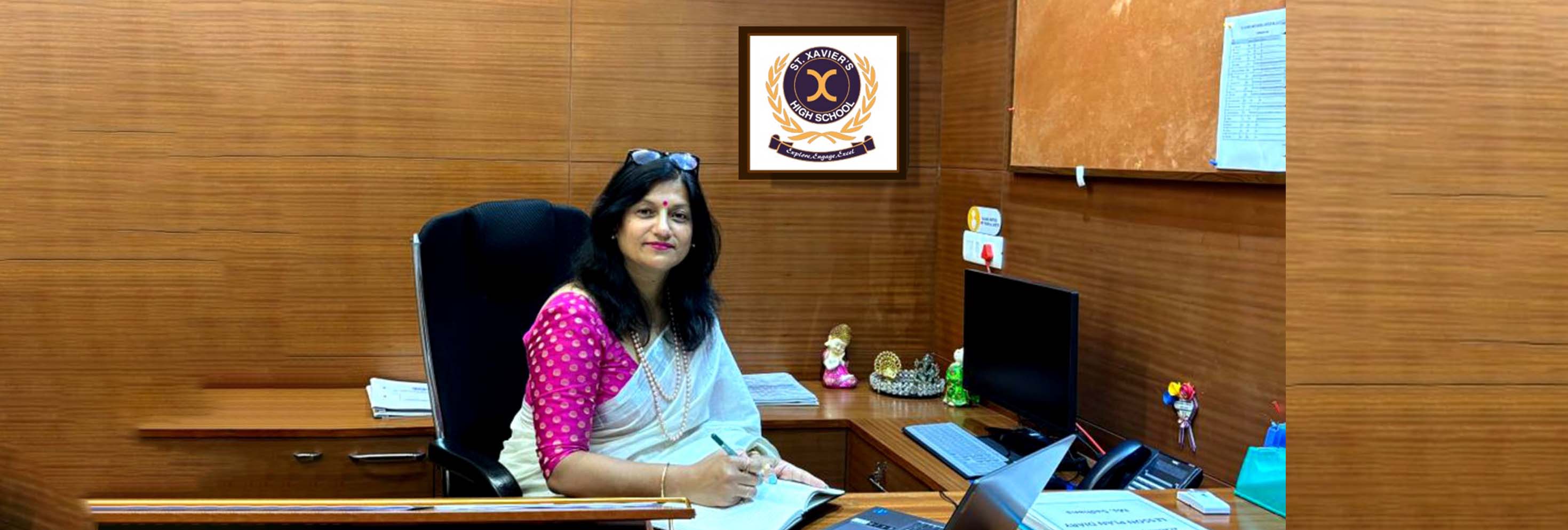 A woman working in an office at the top school in Gurgaon.