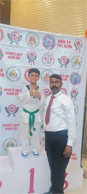 Young Champion Shines in Taekwondo Arena