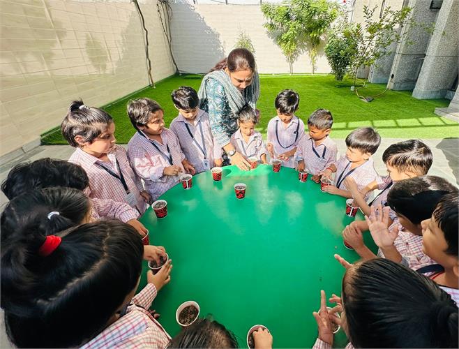 Our Tiny Tots sowing the seeds - KG